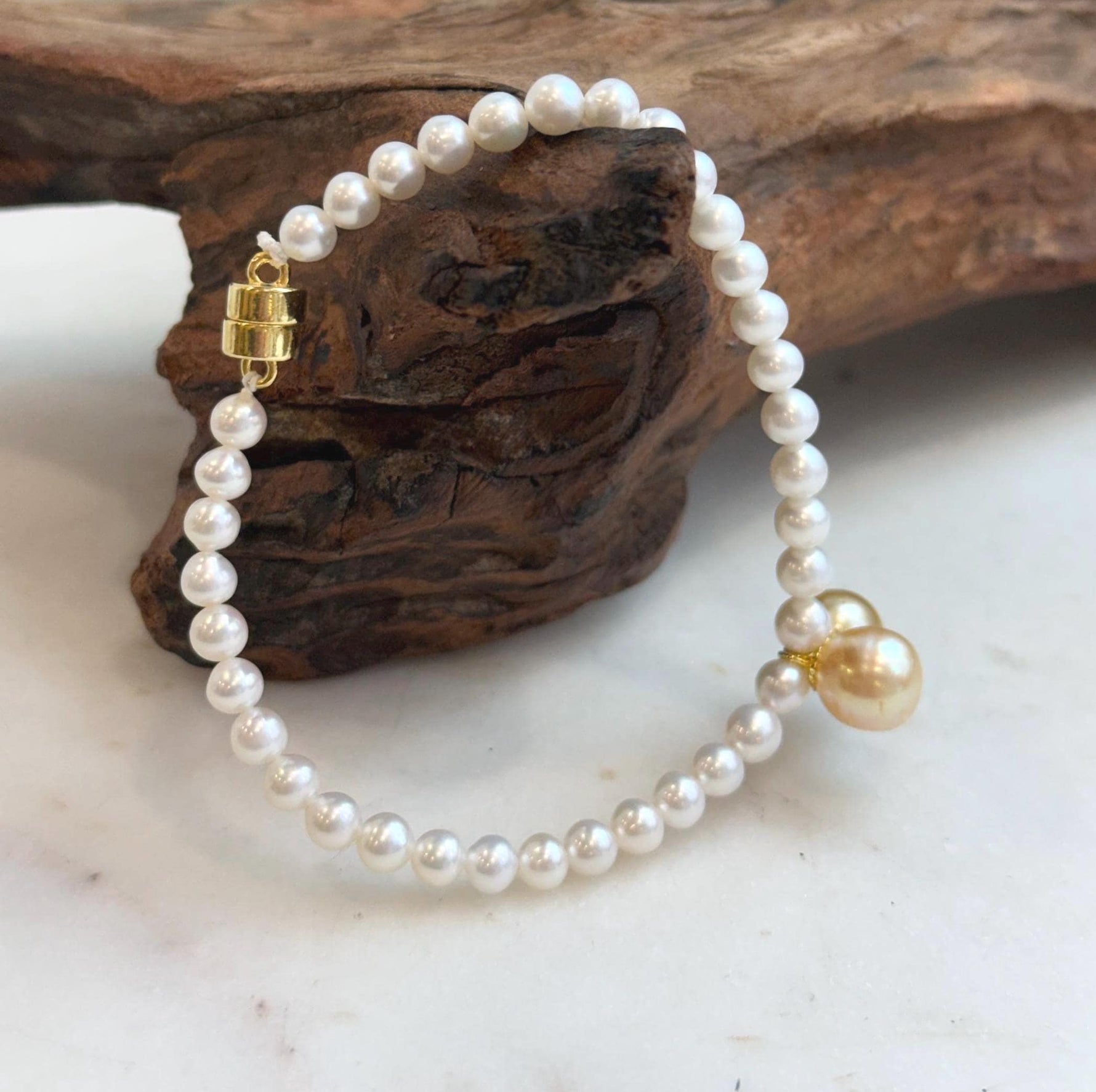Elegant 8.5–8.8mm South Sea golden pearl bracelet crafted with genuine pearls and sterling silver.