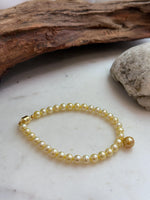 7.6mm South Sea deep tea golden pearl bracelet with genuine saltwater pearls and mirror luster.