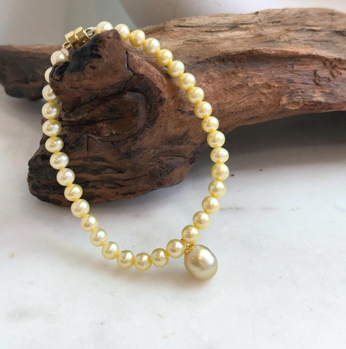 Elegant 9.1mm golden pearl bracelet finished with S925 sterling silver.