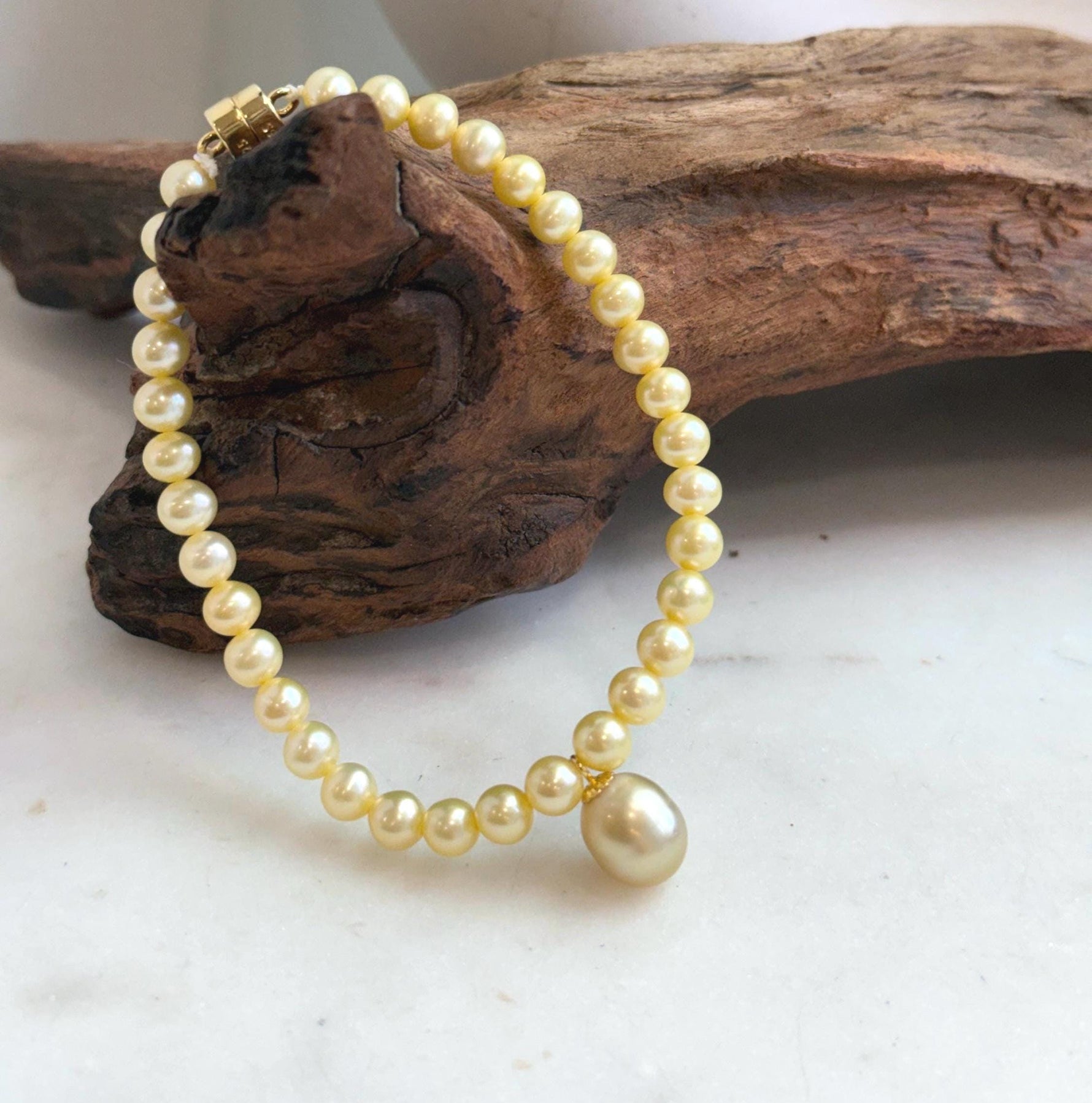 Elegant 9.1mm golden pearl bracelet finished with S925 sterling silver.