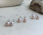 Genuine pale pink freshwater pearl earrings in a classic stud design for elegant everyday jewelry.