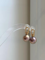 Close-up of 12.1mm Edison rose gold pearls showing extreme mirror luster.