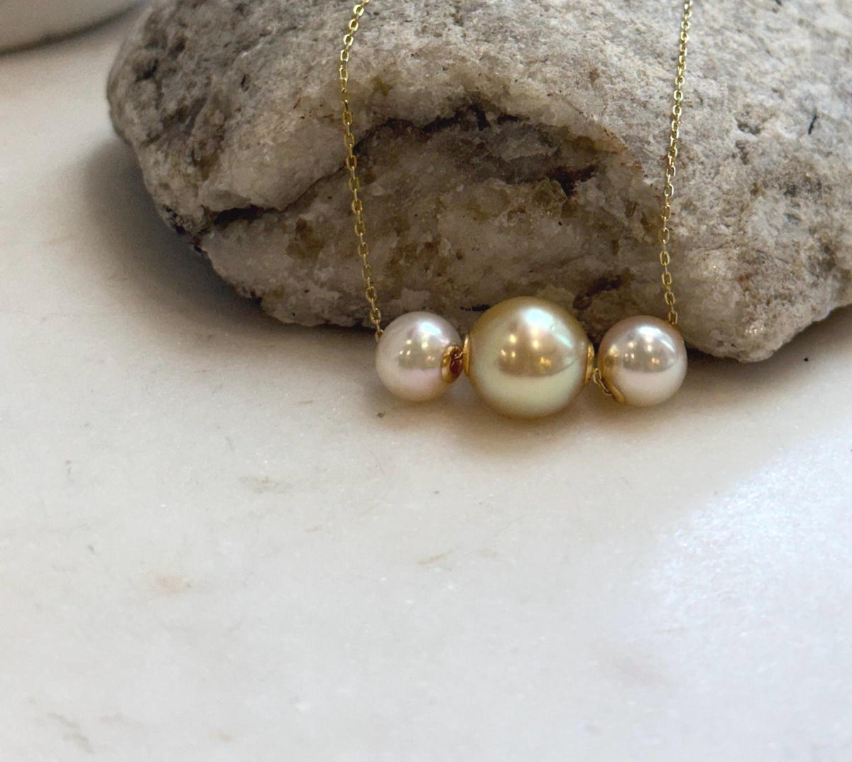 8.3–11.3mm South Sea Golden and Akoya pearl pendant set in solid 18K gold.