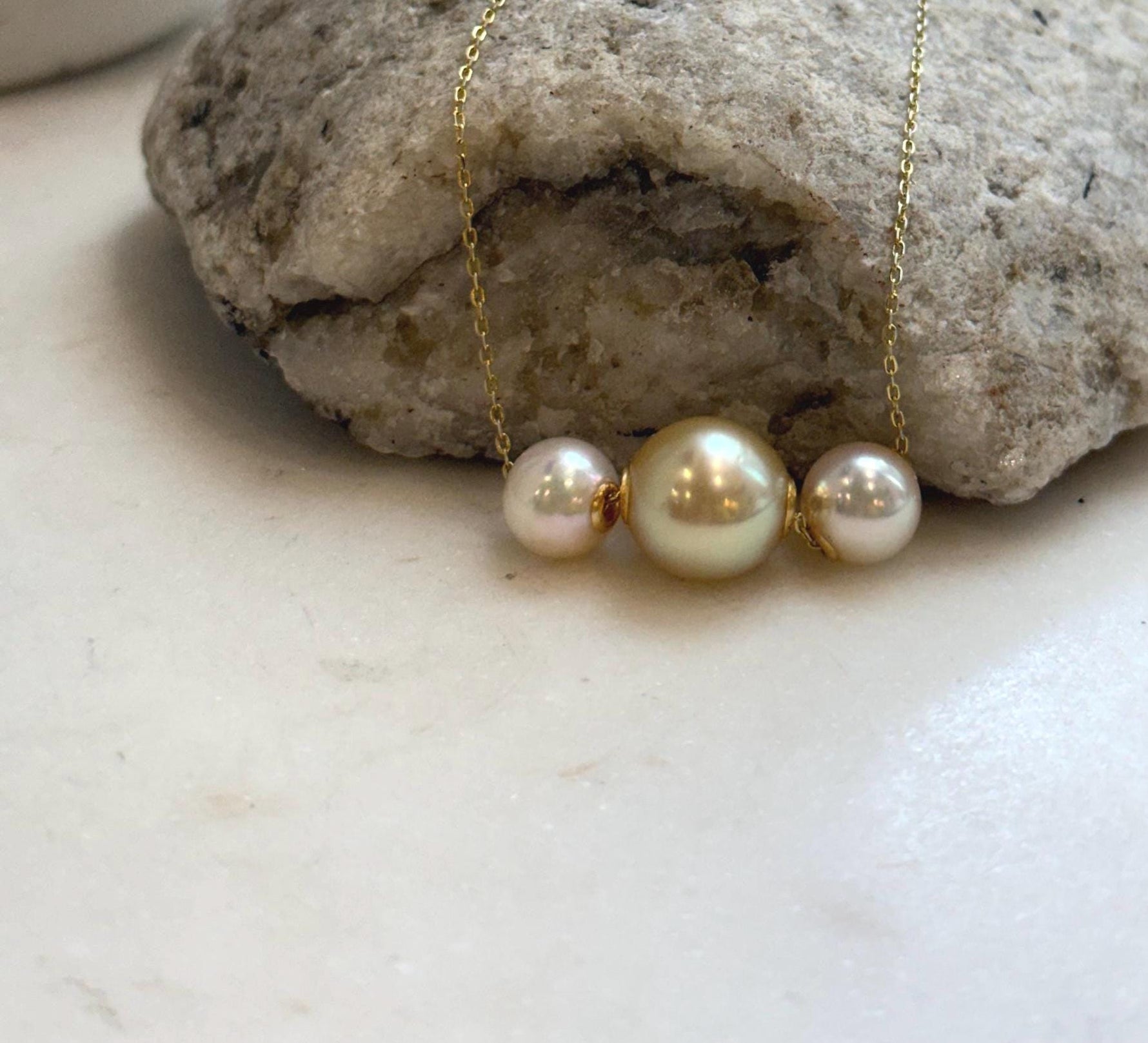 Genuine saltwater pearl pendant featuring three pearls in graduated 8.3–11.3mm sizes.