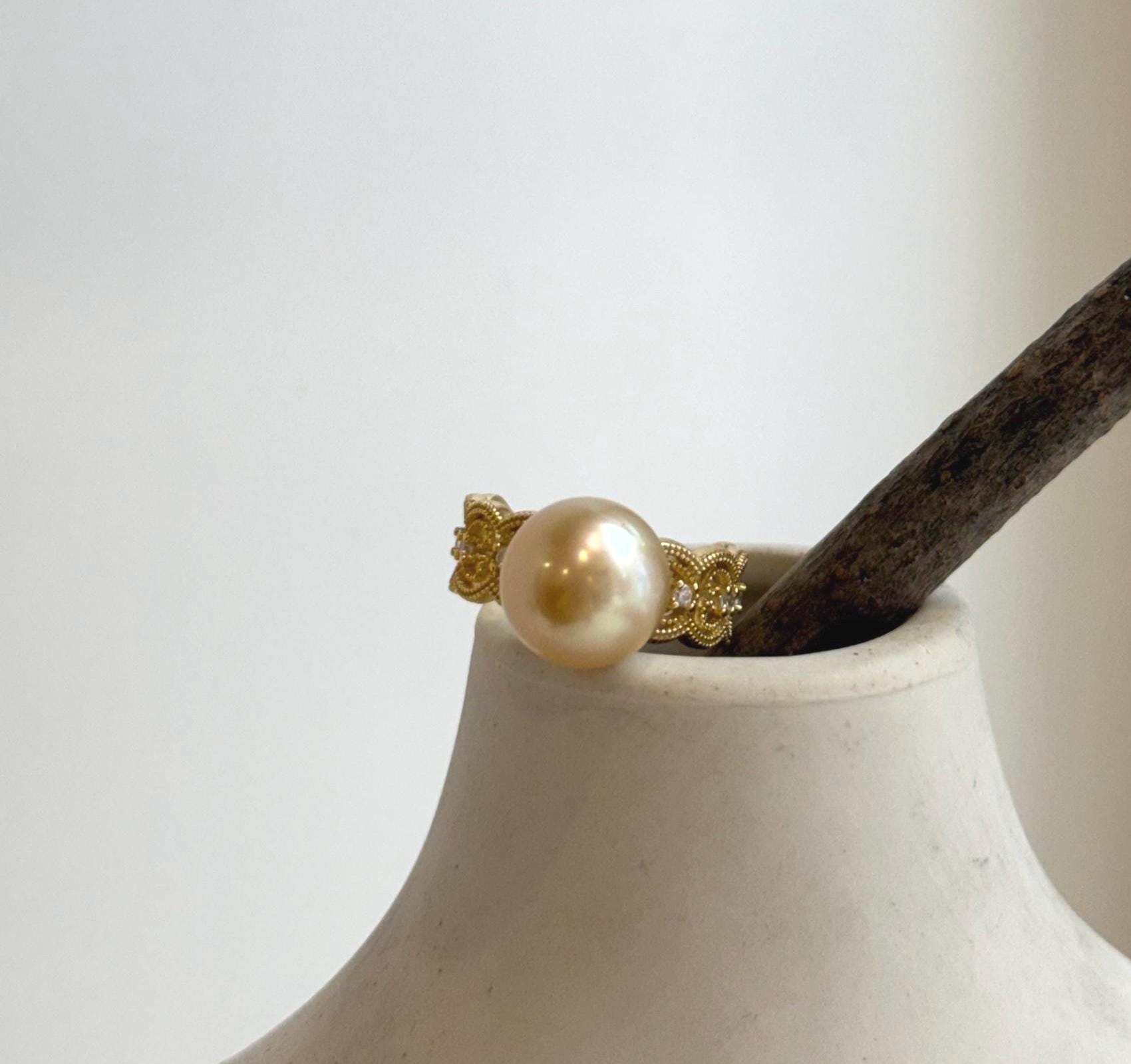 Luxury golden ocean pearl ring with intricate lace design