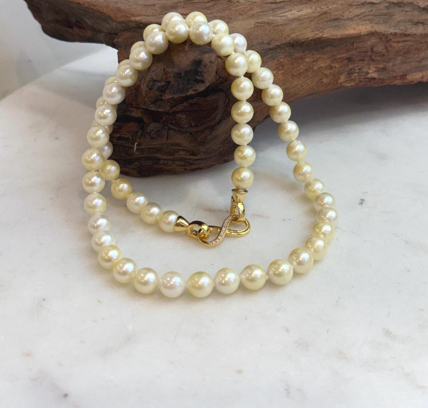 Extreme luster Akoya golden pearl necklace with sterling silver closure
