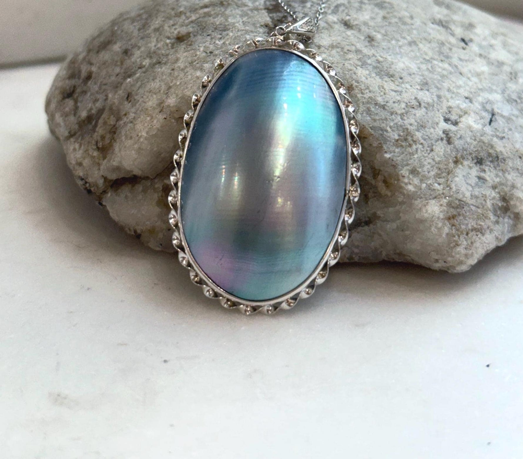 Statement blue Mabe pearl pendant with extreme high luster