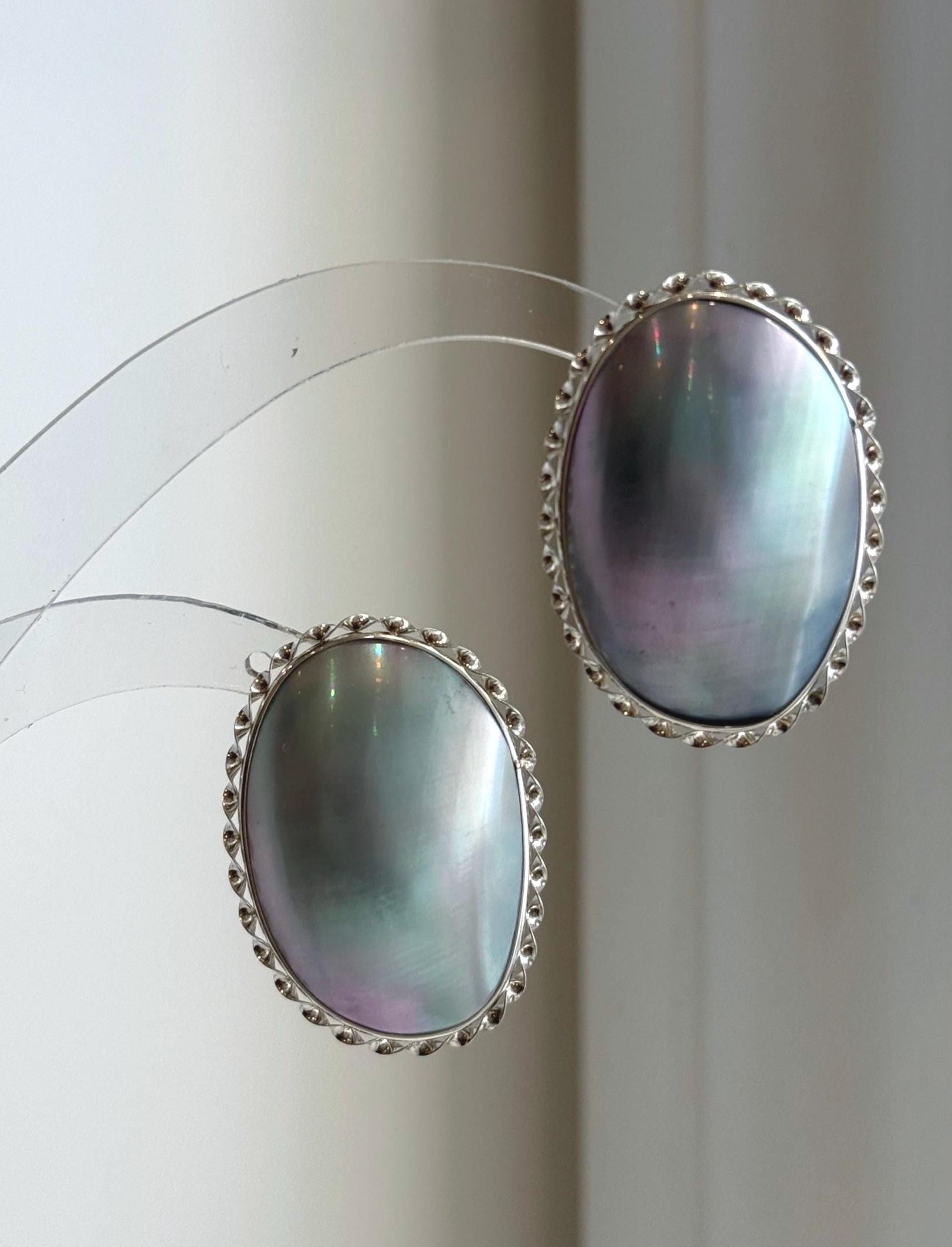 Huge blue iridescent ocean Mabe pearl earrings with extreme mirror luster