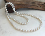 Elly’s 33.2” White Iridescent Drop Pearl Necklace | 7.5–8mm Genuine Pearls | Mirror Luster | Knotted | S925 Sterling Silver