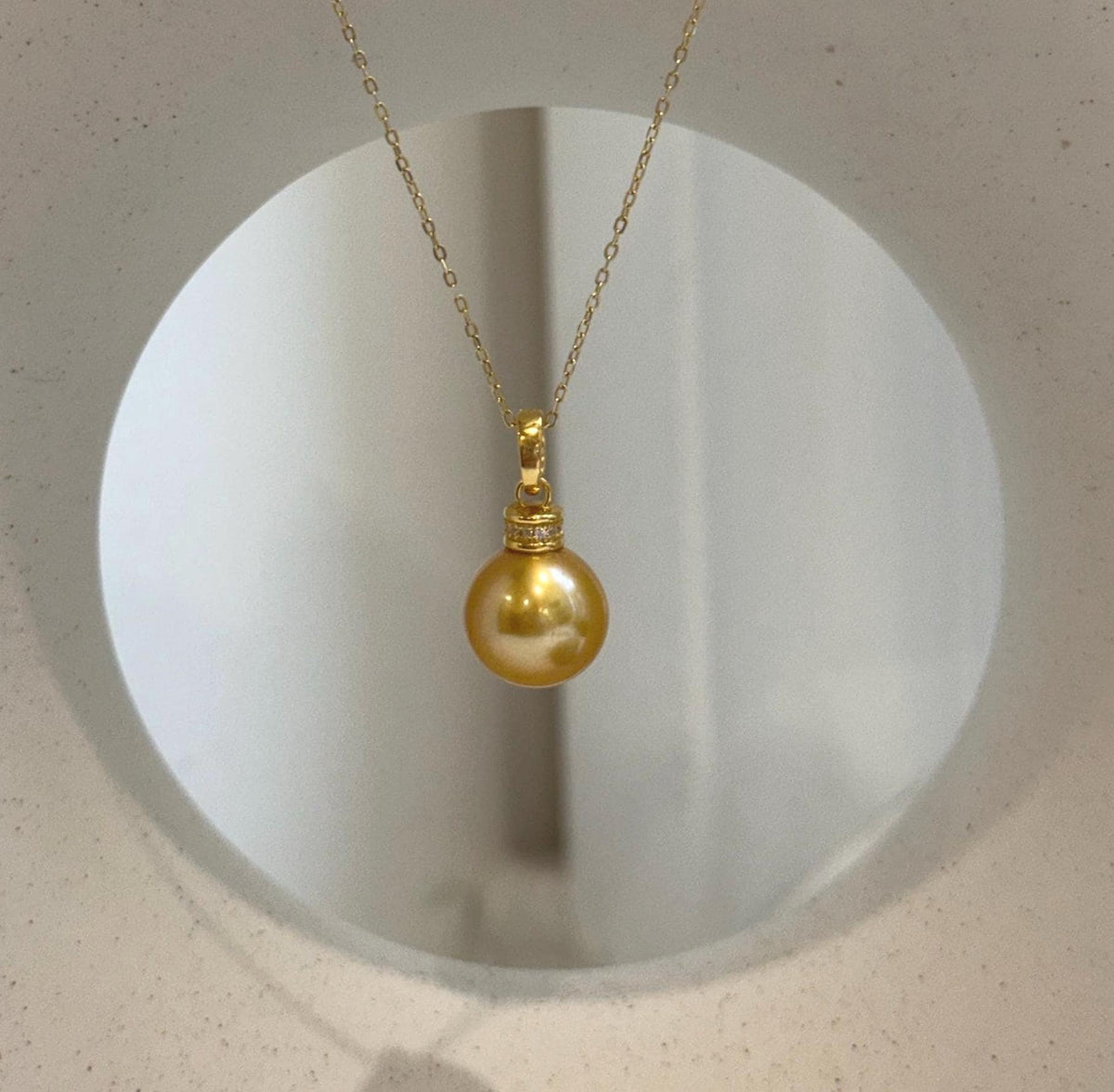 Elegant large Edison freshwater pearl pendant in a deep golden tea tone.