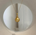 Elegant large Edison freshwater pearl pendant in a deep golden tea tone.