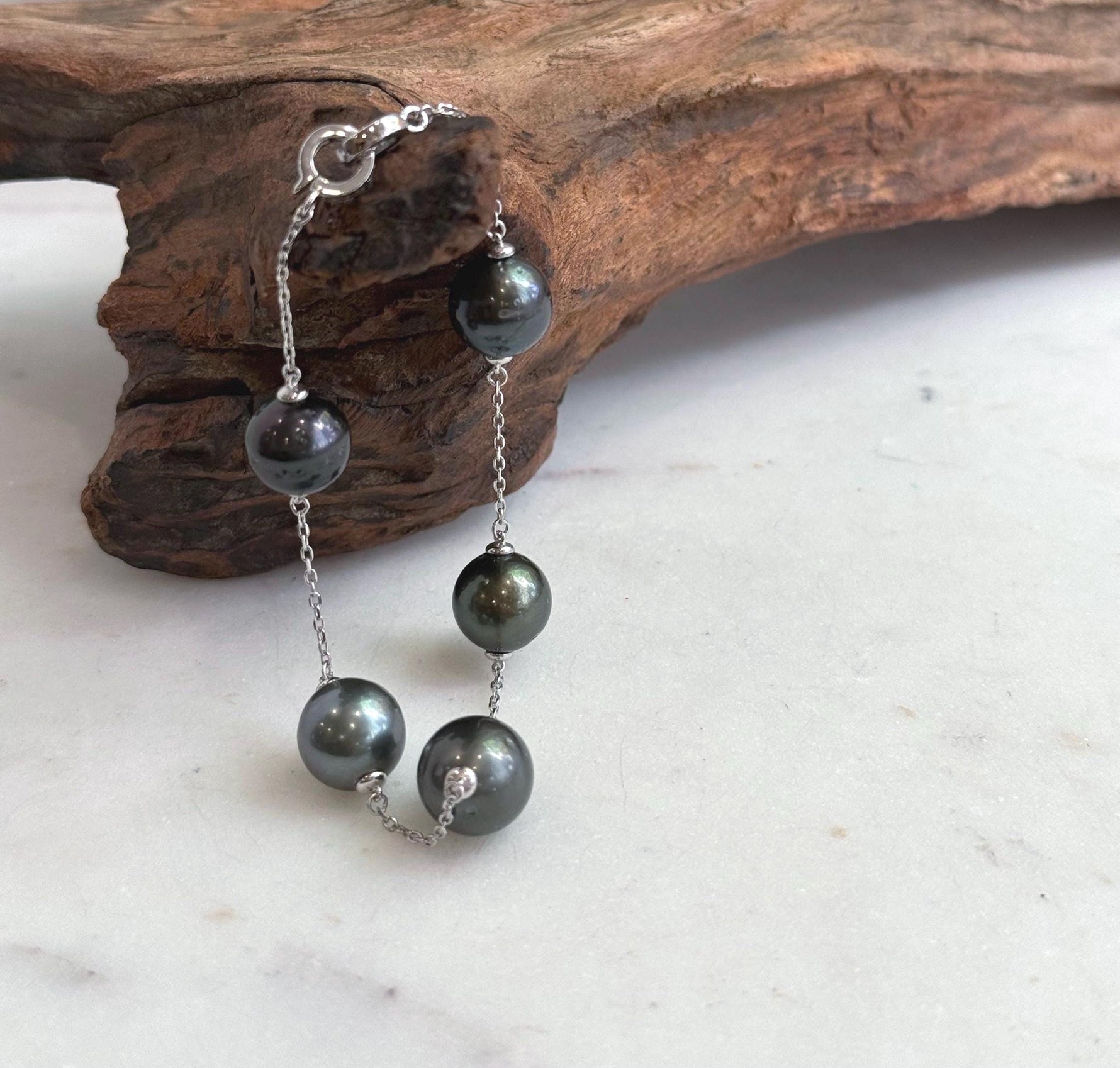 Genuine Tahitian black pearl bracelet with extreme mirrored luster