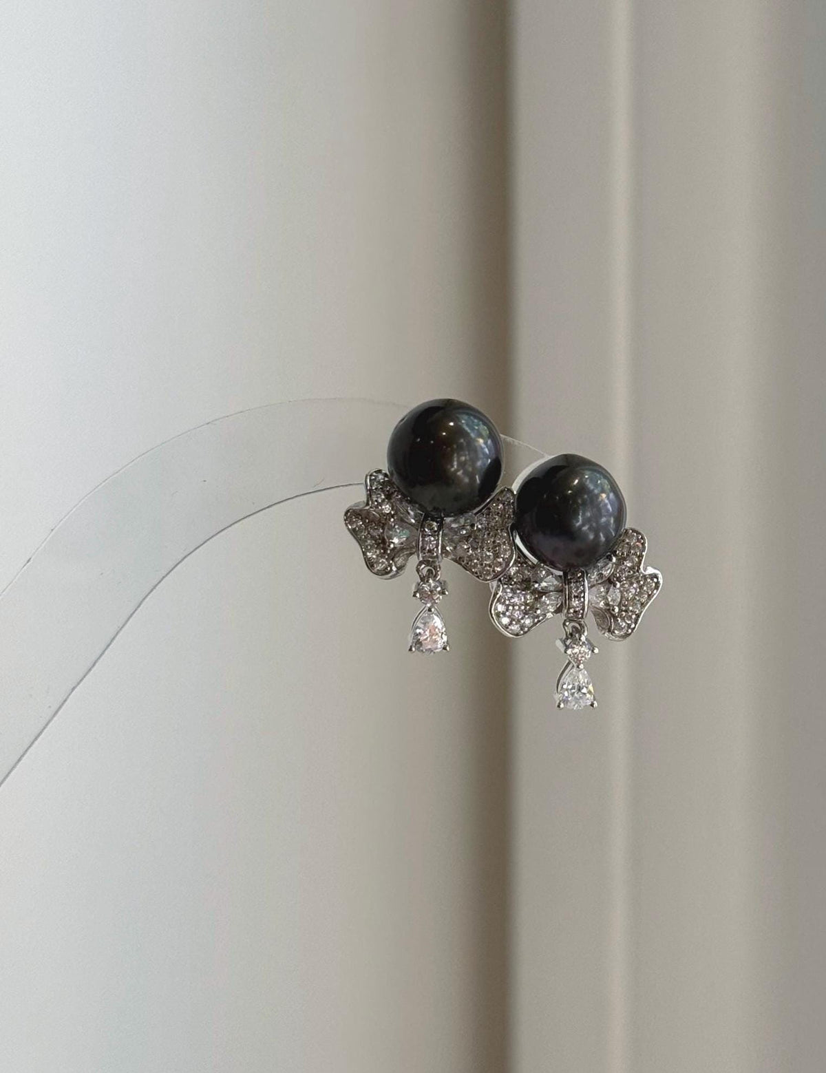 Genuine black Tahitian pearl stud earrings with removable floral silver jackets
