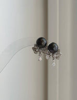 Genuine black Tahitian pearl stud earrings with removable floral silver jackets