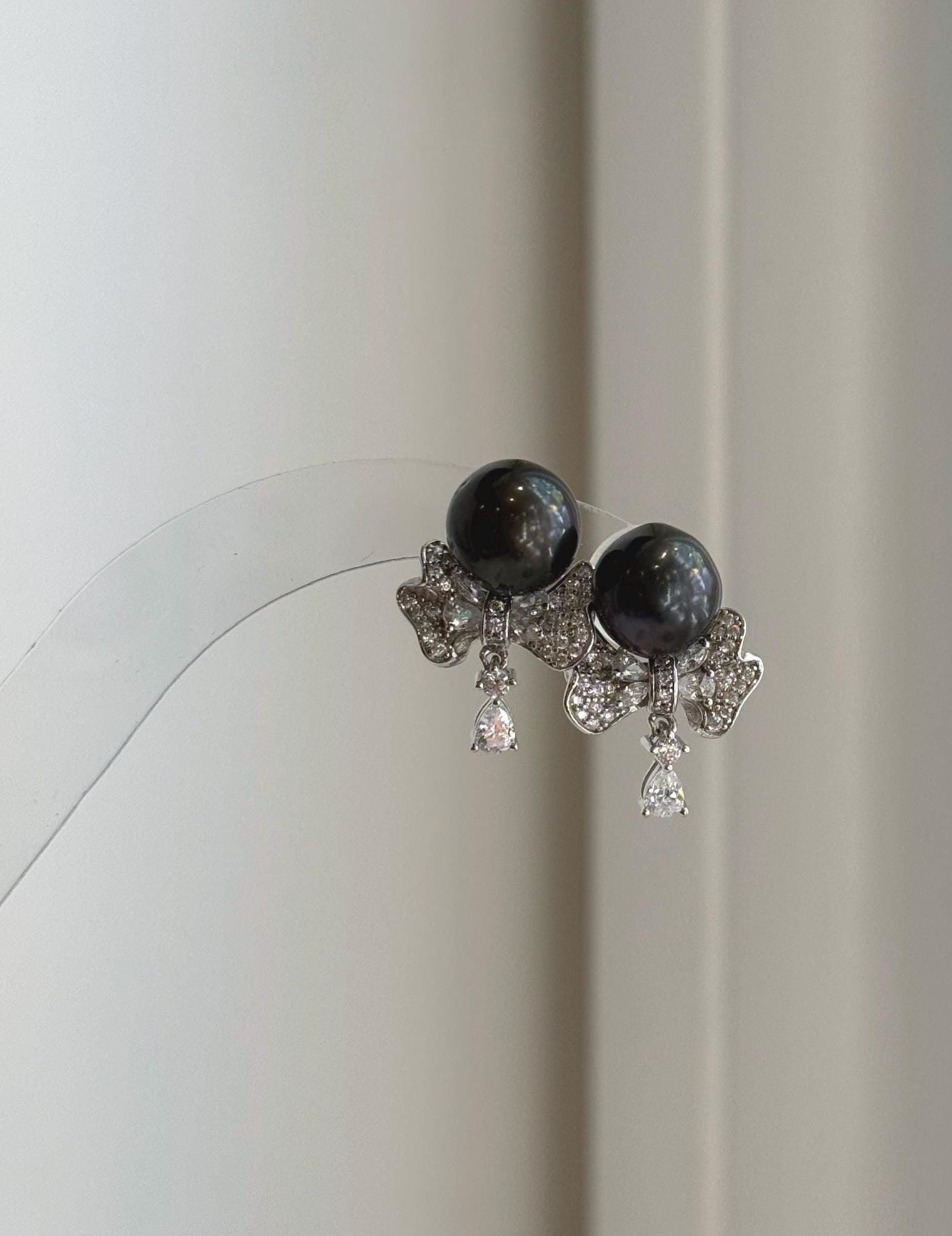 Genuine black Tahitian pearl stud earrings with removable floral silver jackets