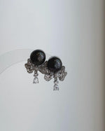 Black Tahitian pearl earrings with sparkling silver earring jackets