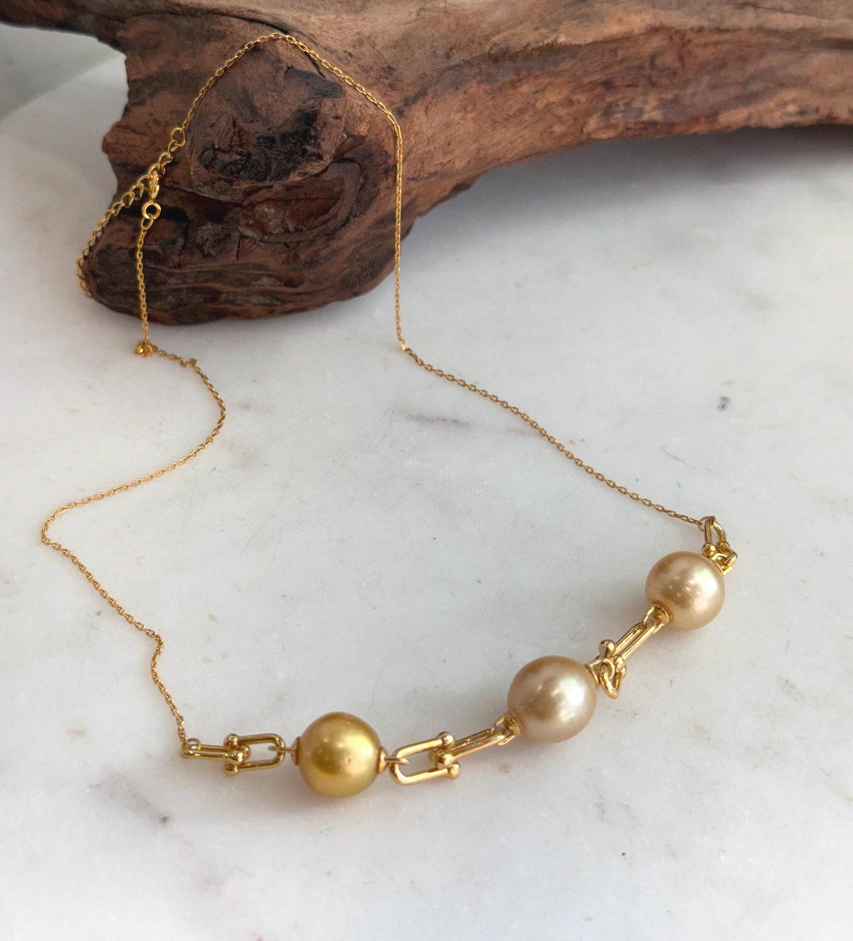 Three South Sea golden pearl satellite necklace with extreme mirror luster