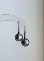 Genuine Tahitian saltwater pearl earrings with cool platinum tones