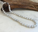 Elegant 17.4 inch freshwater pearl choker necklace with luminous white silver pearls.