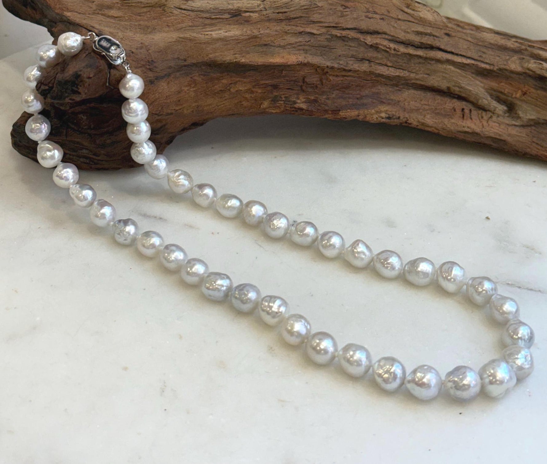 Elegant 17.4 inch freshwater pearl choker necklace with luminous white silver pearls.