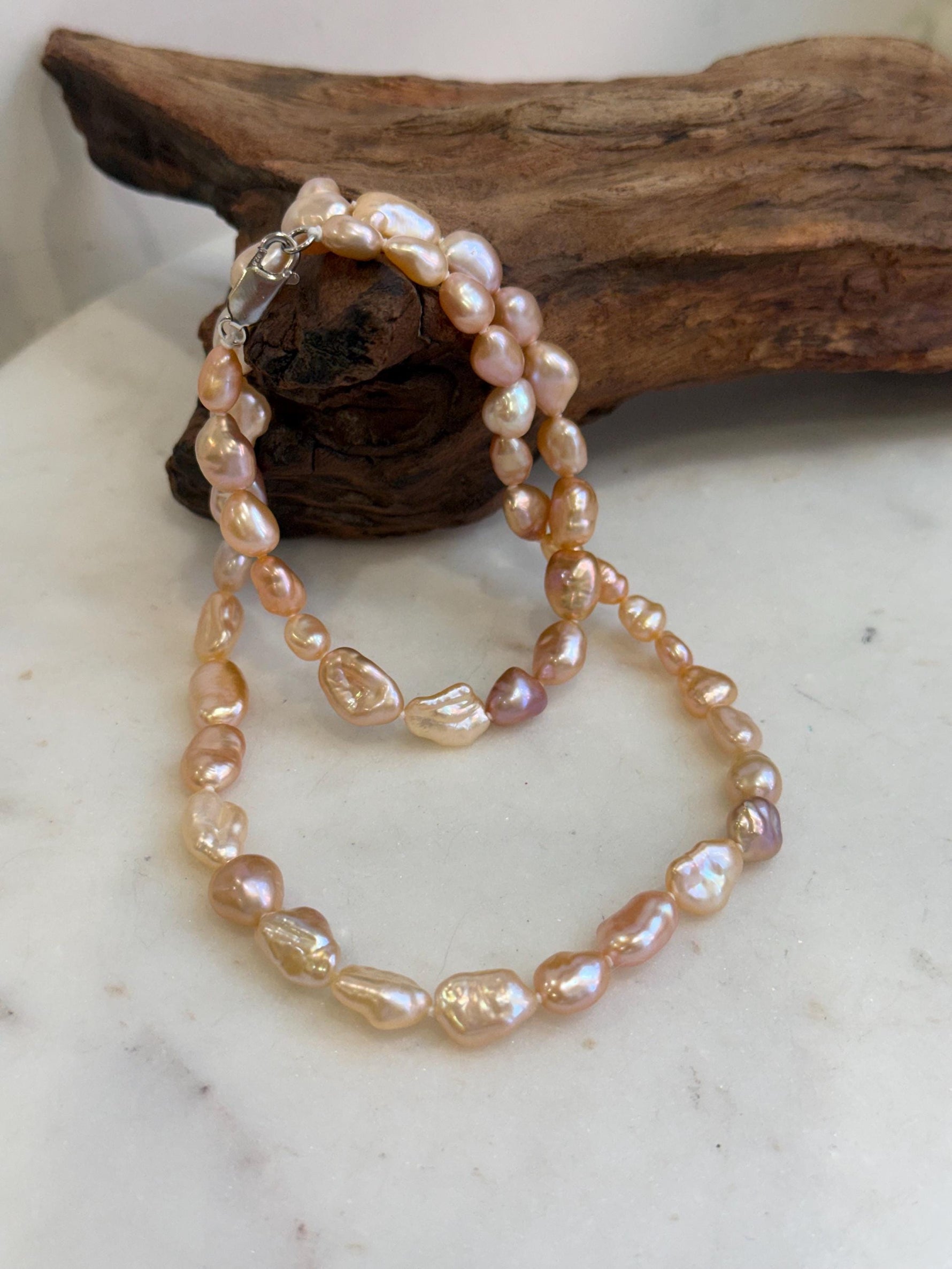 Genuine freshwater Keshi pearl necklace finished with S925 sterling silver hardware.