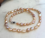Hand-knotted freshwater Keshi pearl strand featuring unique organic-shaped 5.6–9mm pearls.