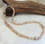 Unique peach rose Keshi pearl choker with organic pearl shapes and brilliant reflective luster.
