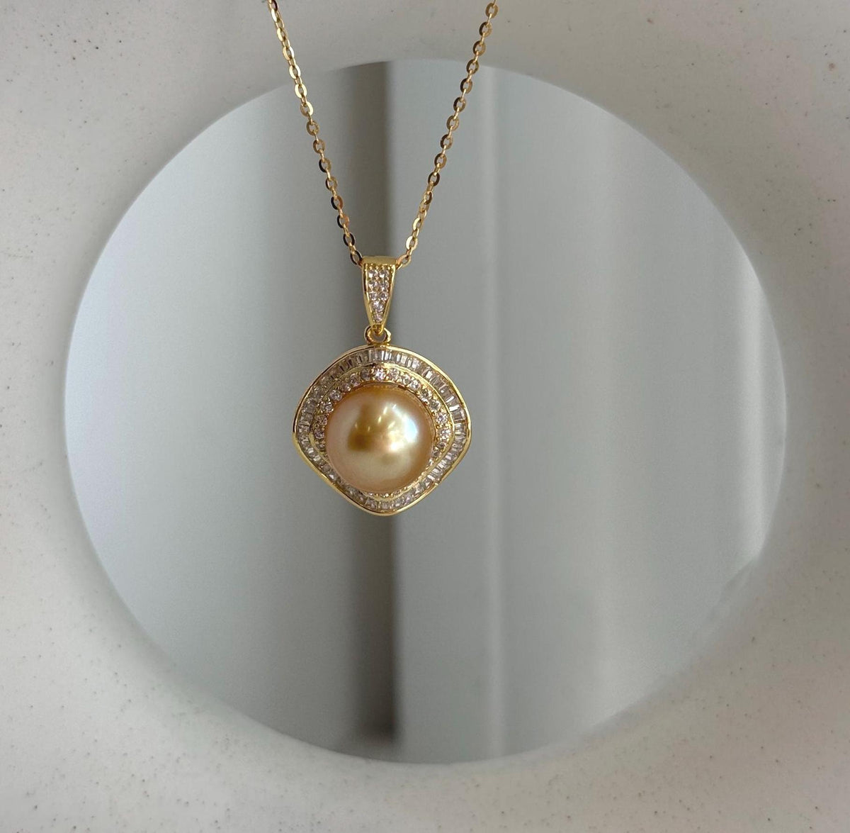 Genuine saltwater pearl pendant featuring a deep tea gold tone and elegant setting