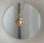Genuine saltwater pearl pendant featuring a deep tea gold tone and elegant setting
