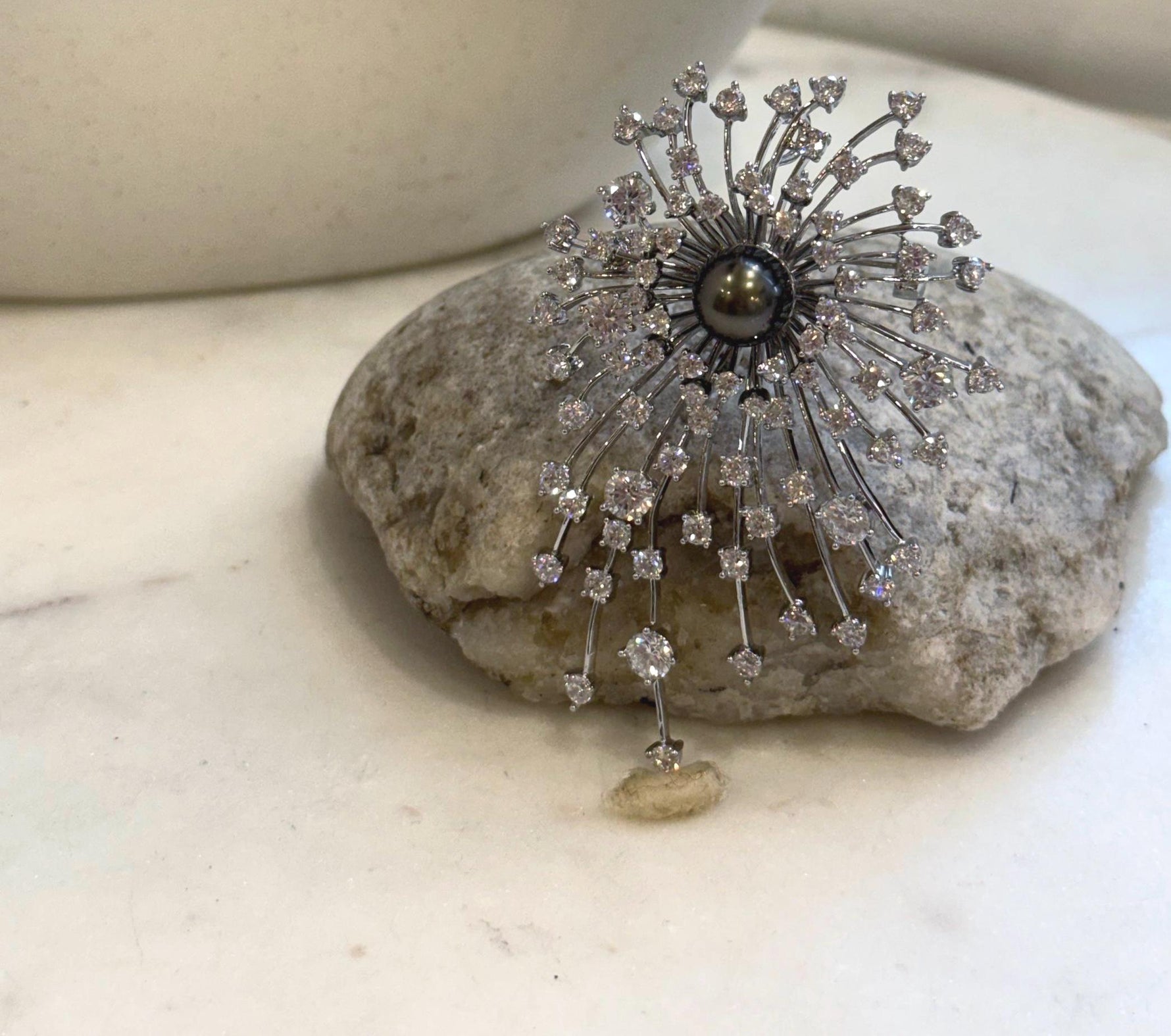 Elly’s 9.3mm Tahitian platinum black ocean pearl fireworks brooch pendant with extreme mirror luster.
