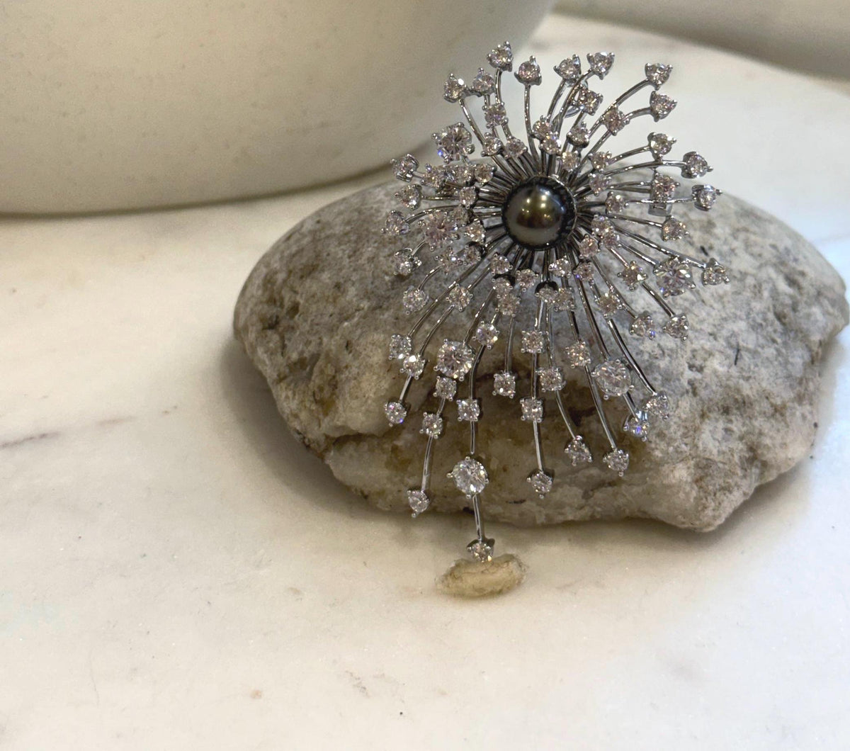 Extreme luster Tahitian ocean pearl brooch with beautiful platinum black natural tones.