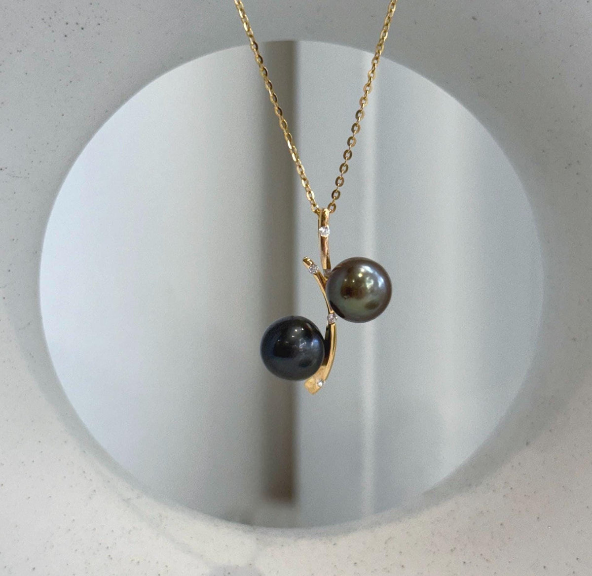 Genuine ocean pearl jewelry featuring a unique two pearl pendant design