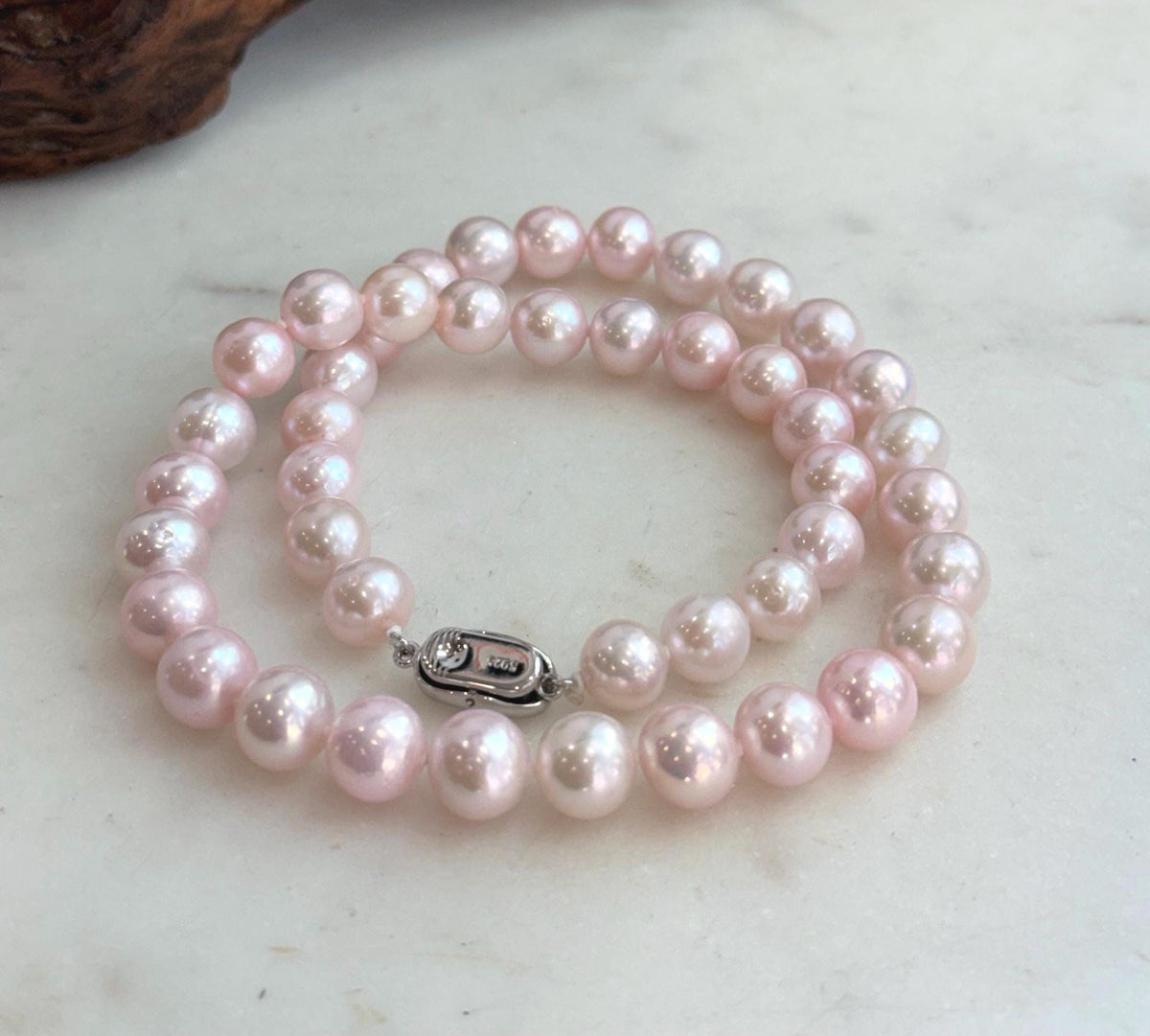 Genuine freshwater pearl necklace finished with an S925 sterling silver clasp.