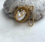 Elegant freshwater baroque pearl jewelry designed to be worn as both a brooch and pendant.