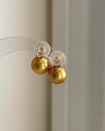 Elly’s 11.3mm Edison golden freshwater pearl stud earrings with extreme mirror luster and S925 sterling silver.