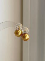 Edison golden pearl earrings measuring approximately 1.4cm high with elegant sterling silver settings.