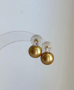 High-luster golden freshwater pearl studs featuring 11.3mm genuine Edison pearls.