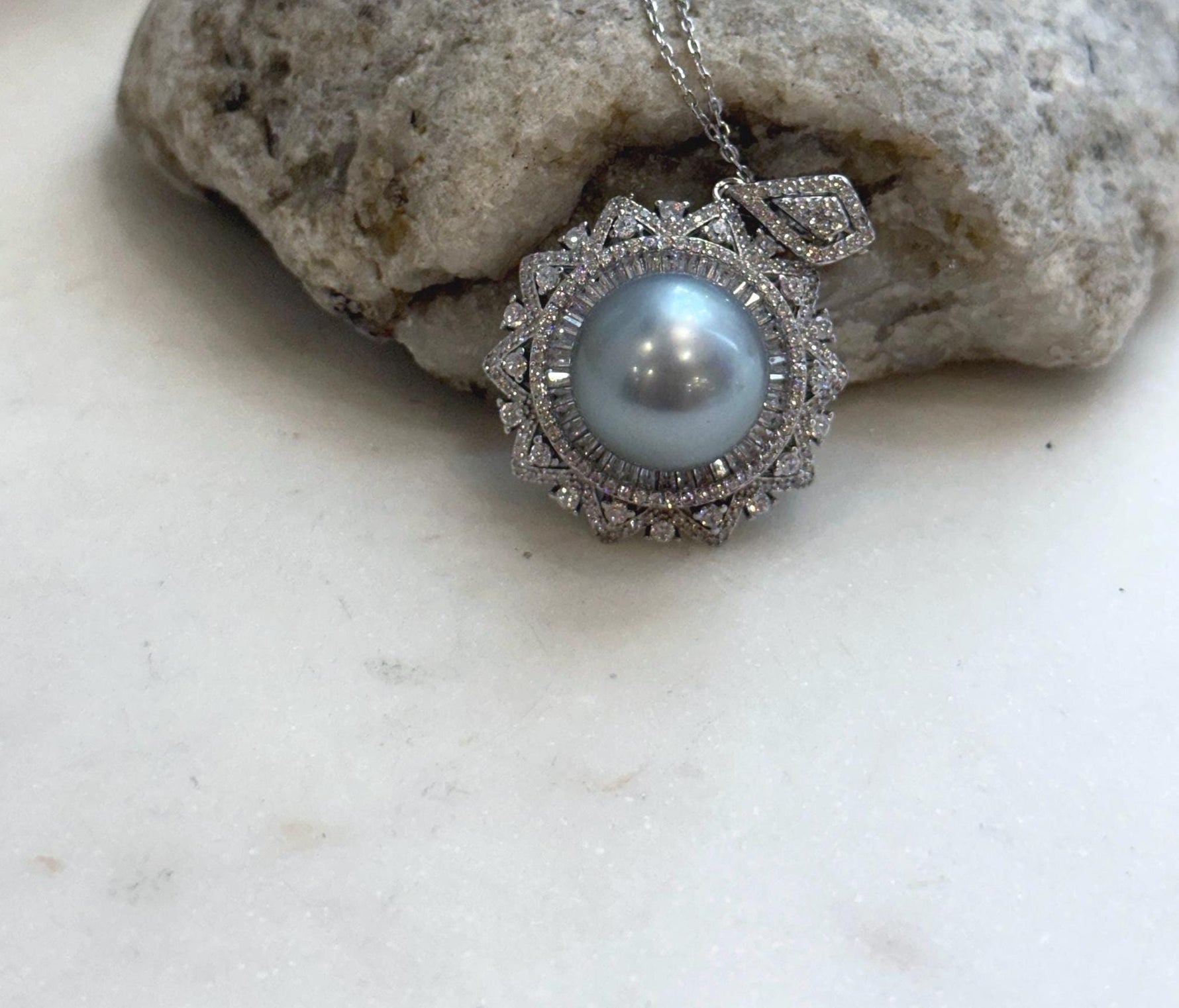 Luxury Tahitian silver pearl pendant with exceptional mirror-like luster and minimalist sterling silver design.