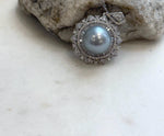 Genuine Tahitian silver saltwater pearl pendant featuring rare large size and brilliant reflective luster.
