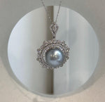 Elegant Tahitian silver ocean pearl necklace with extreme metallic mirror luster and sterling silver setting.