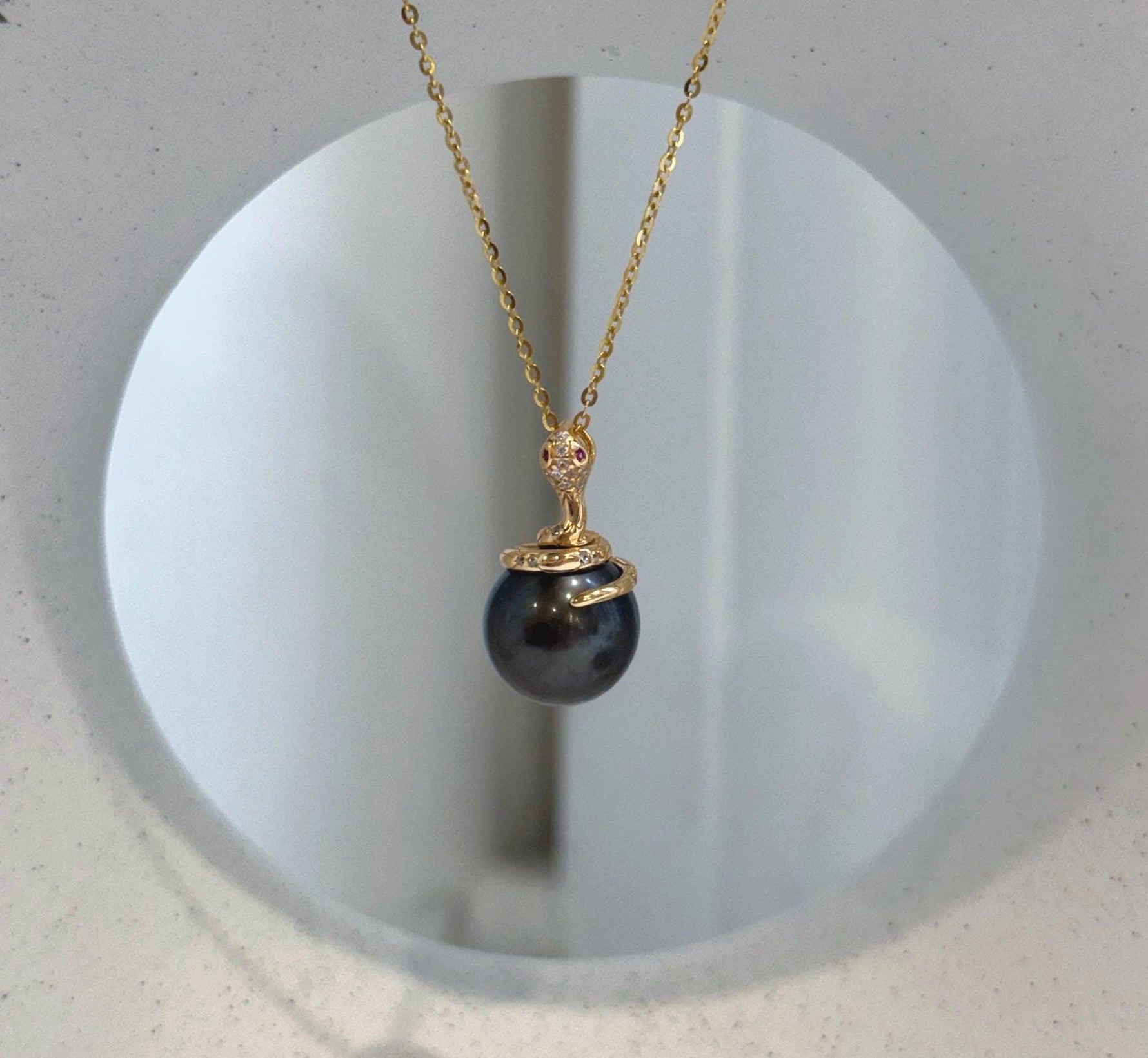 Genuine ocean pearl jewelry with Tahitian chocolate pearl and silver snake motif