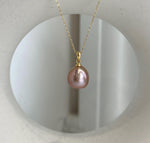 Luxury rose gold Edison pearl necklace pendant with brilliant reflective luster.