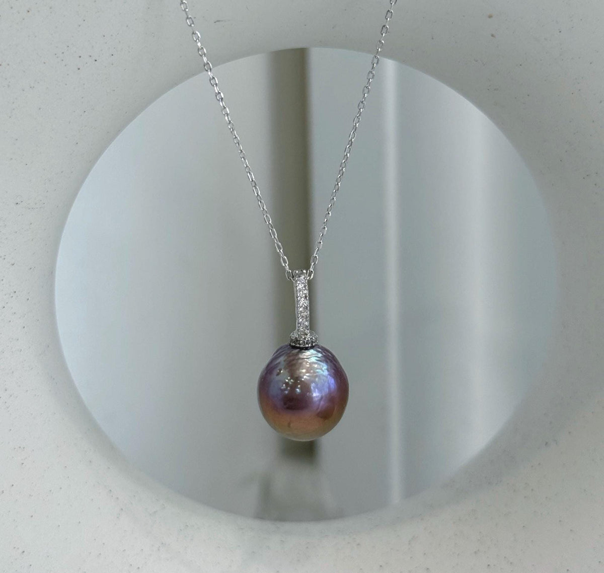 Large colorful Edison freshwater pearl pendant featuring rich rose, purple and golden tones.