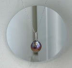 Large colorful Edison freshwater pearl pendant featuring rich rose, purple and golden tones.