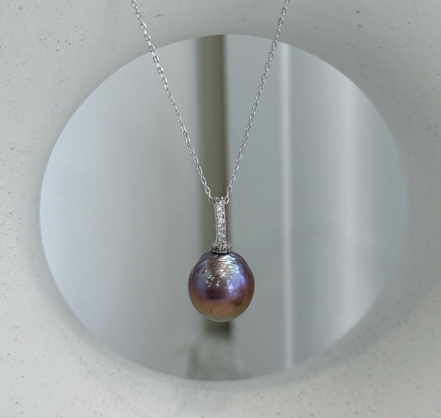 Large colorful Edison freshwater pearl pendant featuring rich rose, purple and golden tones.