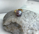 Luxury Edison freshwater pearl ring with smooth glowing surface and strong mirror reflection.
