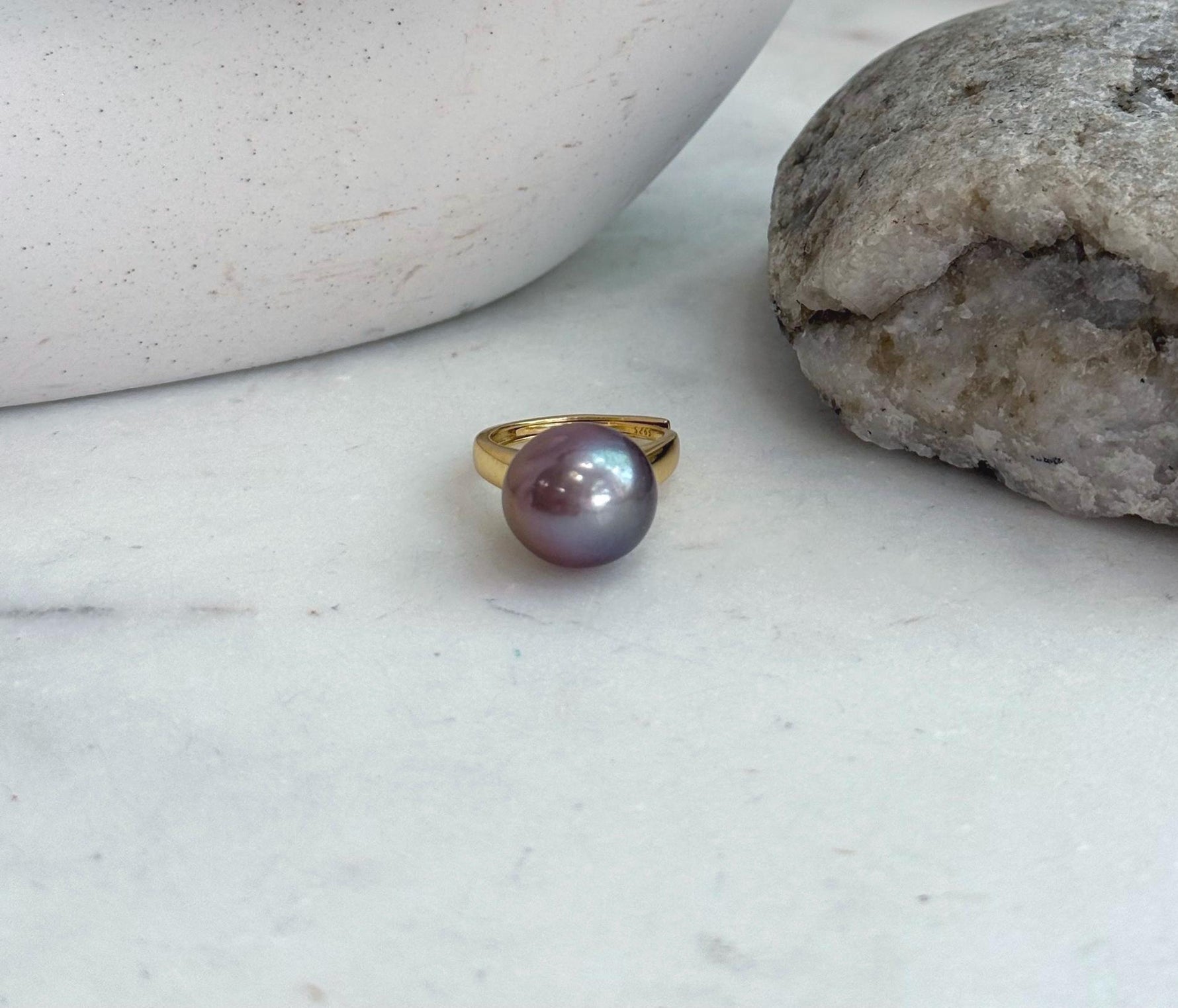 Genuine freshwater Edison pearl jewelry featuring a bright reflective surface and elegant silver ring design.
