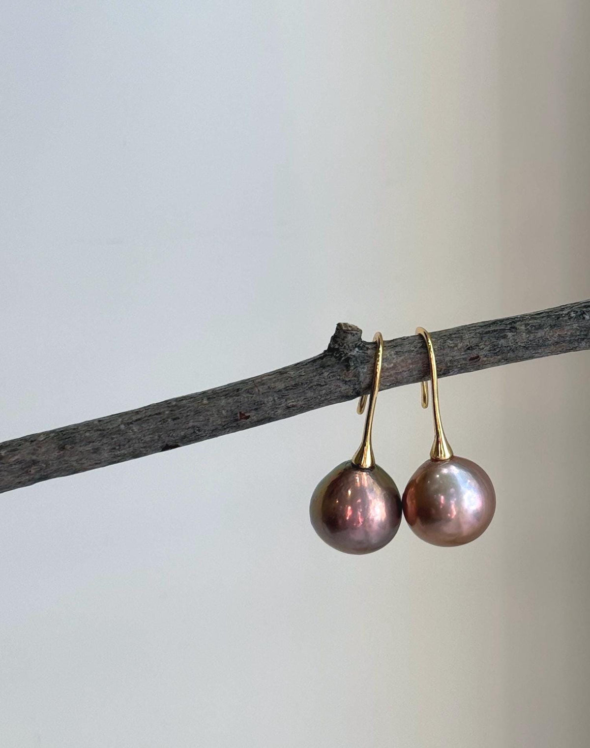 Elly’s 12.6mm Edison rose gold green pearl hook earrings with extreme mirror-like luster and S925 sterling silver.
