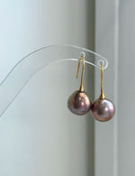 Genuine freshwater Edison pearl earrings featuring 12.6mm rose gold green pearls with beautiful color overtones.