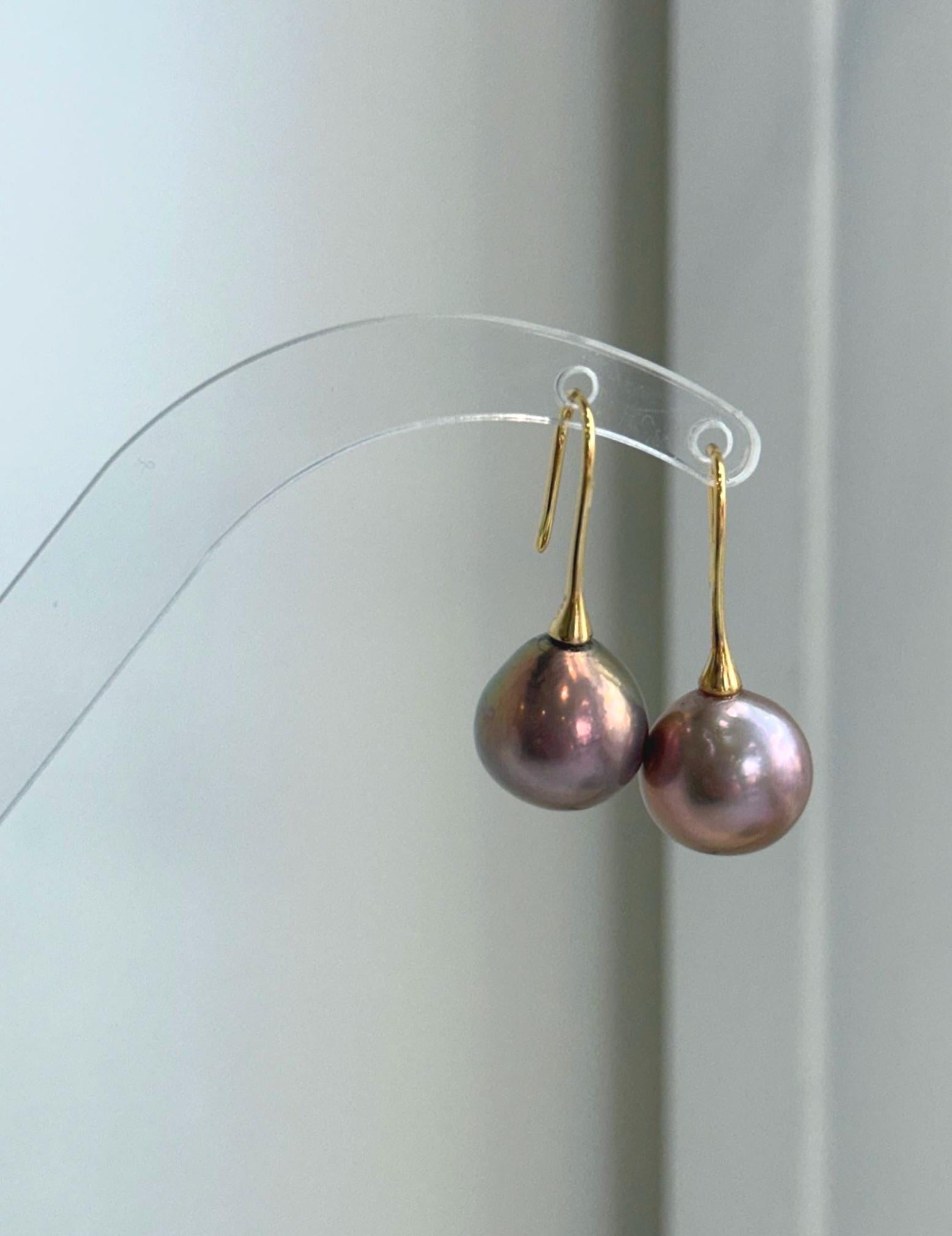 Genuine freshwater Edison pearl earrings featuring 12.6mm rose gold green pearls with beautiful color overtones.